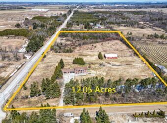 stunning, one-of-a-kind detached home sits on a 12.05-acre corner lot at County Road